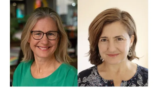 Portrait of two women smiling at the camera, one wearing glasses and a green top, and the other with short brown hair and a patterned blouse.