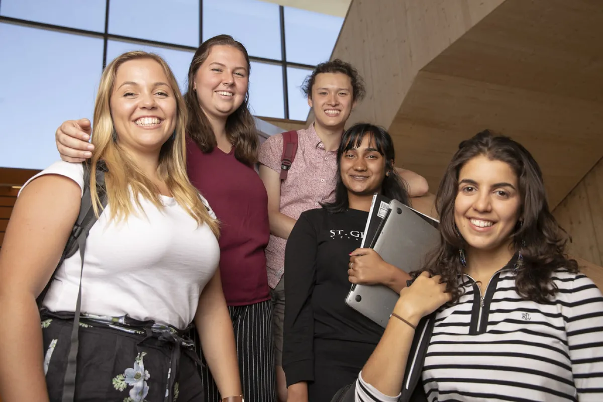 Young females standing together, smiling