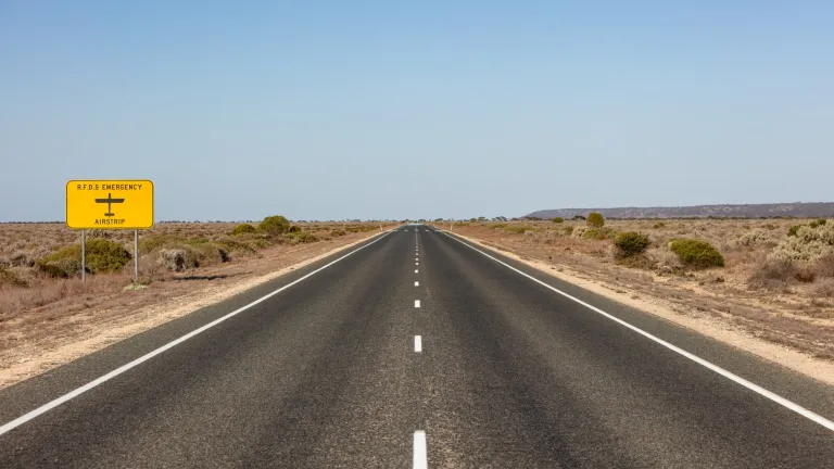 Royal Flying Doctor Emergency Service sign denoting the road may also be used as a landing strip in a medical emergency.
