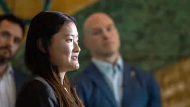 photo of Elizabeth Alfonso with David Pockock in the background