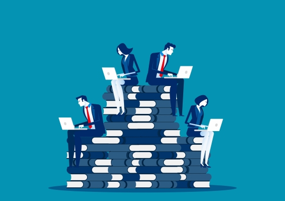 Illustration of five business professionals using laptops while sitting on a stacked pile of large books, symbolizing a hierarchy or progression.